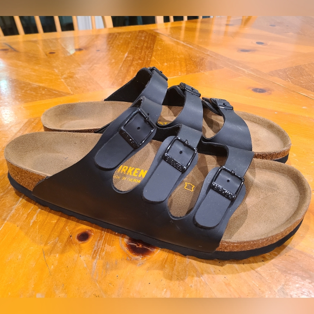 Birkenstock 3 strap slides.